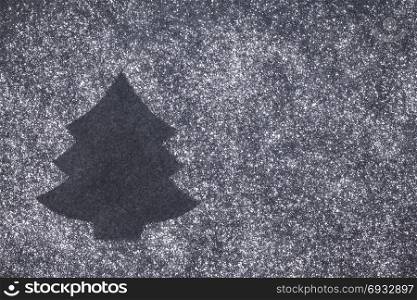 Christmas tree shape surrounded by powdered sugar on slate, Christmas concept with copy space on the side. Christmas Tree