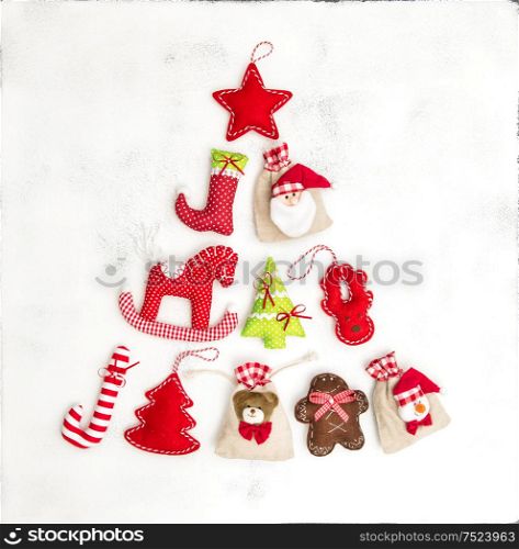 Christmas tree shaped from decorations and gift bags. Holidays background