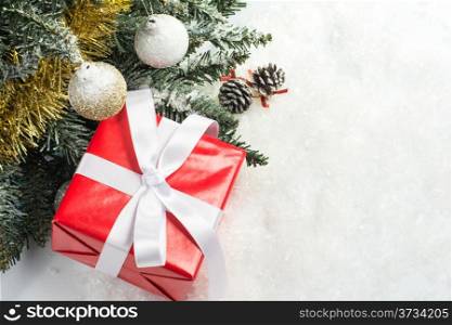 christmas tree shiny christmas balls and gift boxes on snow