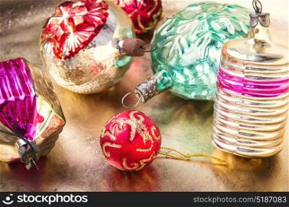 Christmas tree toys. Old-fashioned glass soviet christmas fur-tree toys on retro gold background.Christmas holidays