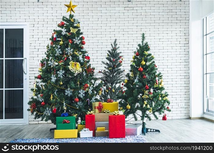 Christmas tree with red gifts in the white wall room background Decoration During Christmas and New Year.