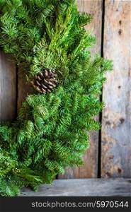 Christmas tree wreath on rustic wooden background