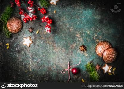 Christmas vintage background with fir branches, cookies and gingerbreads, top view frame