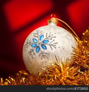 Christmas white ball with Red Background.