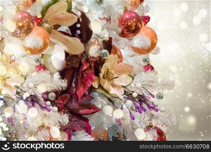 christmas white tree with holiday red and orange decorations and bokeh lights. christmas fir tree with decorations