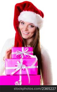 Christmas winter happiness concept. Woman in wearing santa helper hat holding stack of pink presents gift boxes isolated on white