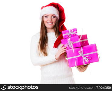 Christmas winter happiness concept. Woman in wearing santa helper hat holding stack of pink presents gift boxes isolated on white