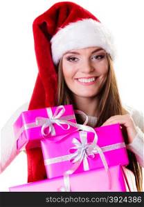 Christmas winter happiness concept. Woman in wearing santa helper hat holding stack of pink presents gift boxes isolated on white