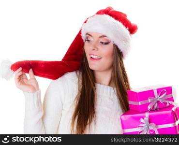 Christmas winter happiness concept. Woman wearing santa helper hat holding stack of pink presents gift boxes isolated on white