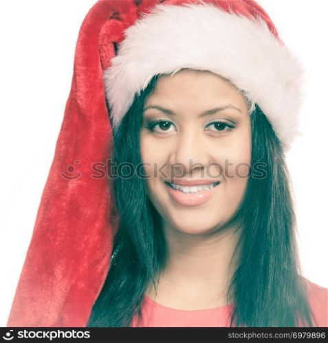 Christmas winter happiness concept. Young woman girl mixed race wearing santa helper hat portrait. White background