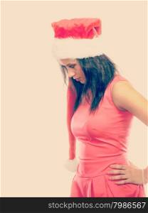 Christmas winter happiness concept. Young woman girl mixed race wearing santa helper hat portrait. Instagram fliter
