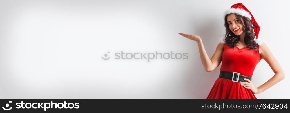 Christmas woman with open hand palm present poduct, white background with copy space for text. Christmas woman with open hand palm