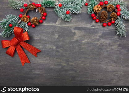 Christmas wooden background with Christmas tree and red decorations. Christmas Wreath with Rustic Wood Background.