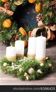 Christmas wreath candle. Christmas wreath with gold stars for candle