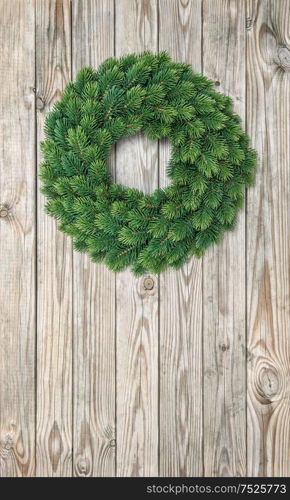 Christmas wreath decoration on rustic wooden background. Vintage style toned picture