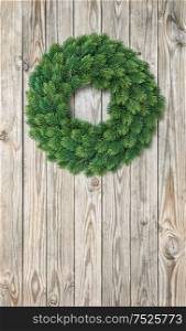 Christmas wreath decoration on rustic wooden background. Vintage style toned picture