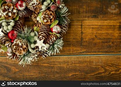 Christmas wreath formed by natural elements as pine cones and fruits