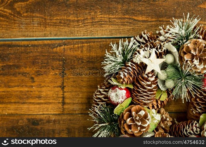 Christmas wreath formed by natural elements as pine cones and fruits