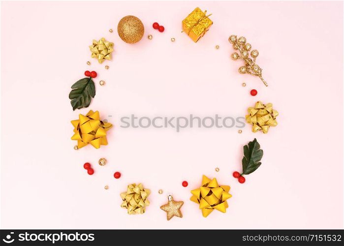 Christmas wreath on pink background. Christmas decoration. Flat lay, top view, copy space