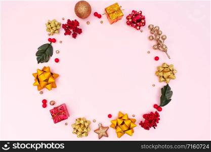 Christmas wreath on pink background. Christmas decoration. Flat lay, top view, copy space