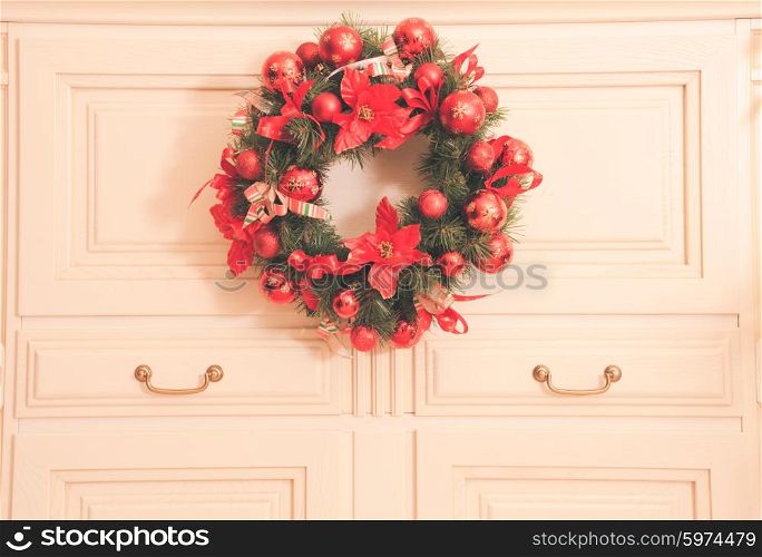 Christmas wreath on the furniture in the room. Home decor. Home decor