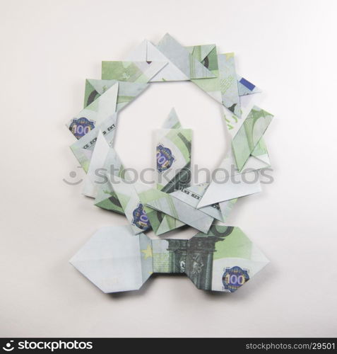 Christmas wreath origami. Christmas wreath origami banknotes on a white background. Handmade