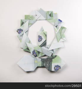 Christmas wreath origami. Christmas wreath origami banknotes on a white background. Handmade