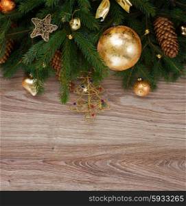 christmas wreath with lights. christmas evergreen tree branches with pine cones and golden decorations