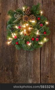 christmas wreath with lights. hanging christmas green wreath with glowing lights