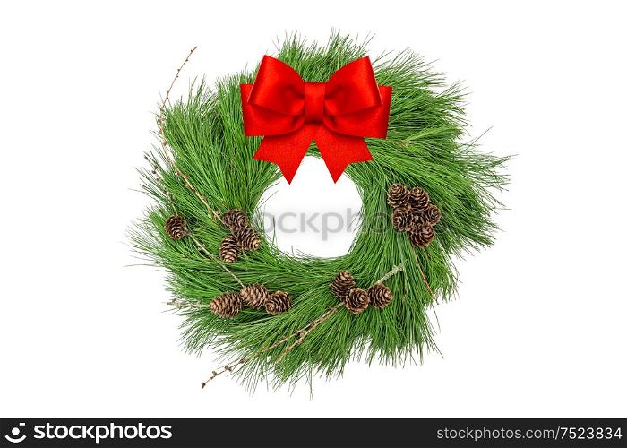 Christmas wreath with pine cones and red ribbon bow isolated on white background
