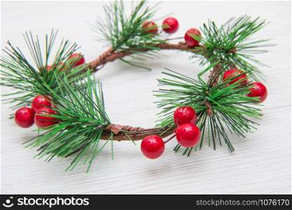 Christmas wreath with red decoration and fir branches