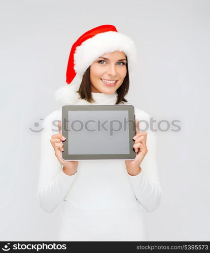 christmas, x-mas, electronics, gadget concept - smiling woman in santa helper hat with blank screen tablet pc