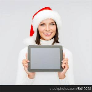 christmas, x-mas, electronics, gadget concept - smiling woman in santa helper hat with blank screen tablet pc