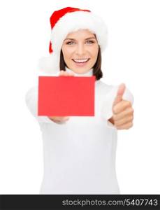 christmas, x-mas, people, advertisement, sale concept - happy woman in santa helper hat with blank red card showing thumbs up