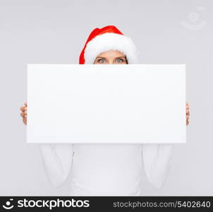 christmas, x-mas, people, winter, advertisement and sale concept - surprised woman in santa helper hat with blank white board