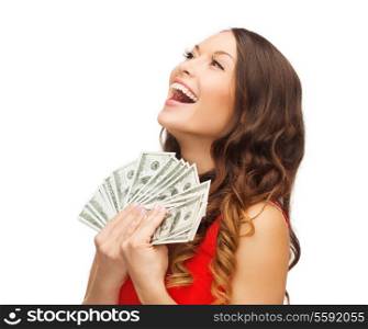 christmas, x-mas, sale, banking concept - smiling woman in red dress with us dollar money