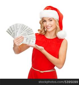 christmas, x-mas, sale, banking concept - smiling woman in santa helper hat with us dollar money
