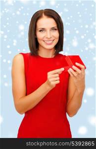 christmas, x-mas, valentine&#39;s day, celebration concept - surprised woman in red dress with jewellery gift box