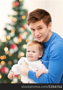christmas, x-mas, winter, family, people, happiness concept - happy father with adorable baby