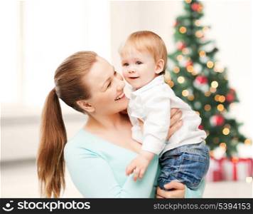christmas, x-mas, winter, family, people, happiness concept - happy mother with adorable baby