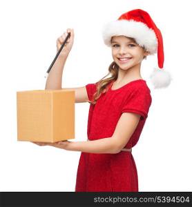 christmas, x-mas, winter, happiness concept - smiling girl in santa helper hat with gift box and magic wand