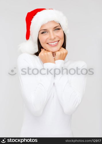 christmas, x-mas, winter, happiness concept - smiling woman in santa helper hat