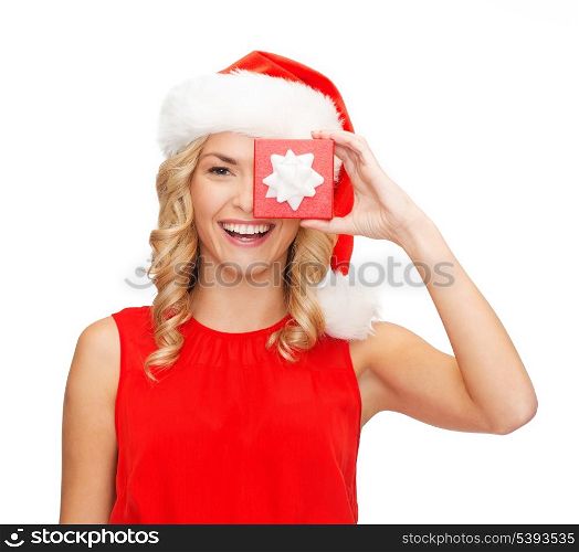 christmas, x-mas, winter, happiness concept - smiling woman in santa helper hat with small jewelry gift box