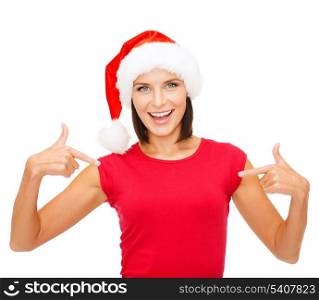 christmas, x-mas, winter, happiness concept - smiling woman in santa helper hat and red shirt