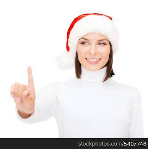 christmas, x-mas, winter, happiness concept - smiling woman in santa helper hat pressing vitrual button