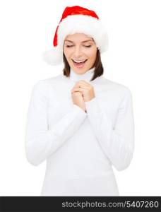 christmas, x-mas, winter, happiness concept - surprised woman in santa helper hat
