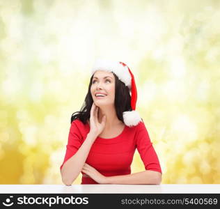christmas, x-mas, winter, happiness concept - surprised woman in santa helper hat looking up