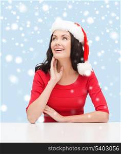 christmas, x-mas, winter, happiness concept - surprised woman in santa helper hat looking up