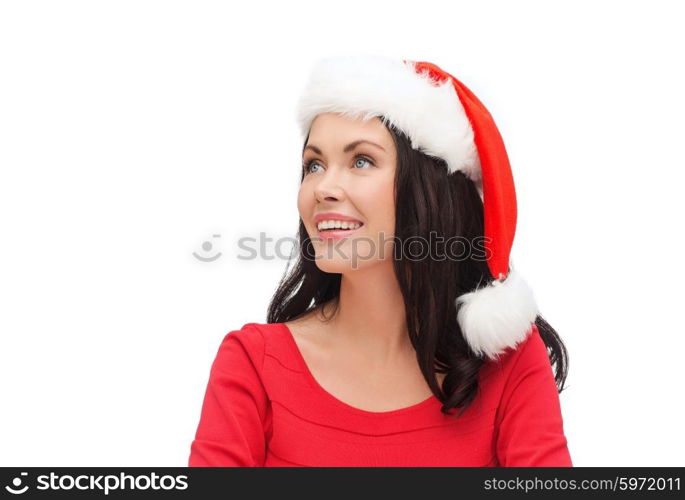 christmas, x-mas, winter, happiness concept - surprised woman in santa helper hat looking up