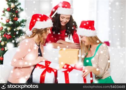 christmas, x-mas, winter, happiness concept - three smiling women in santa helper hats with many gift boxes